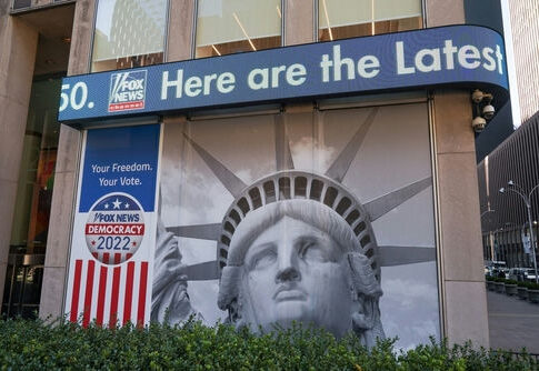 Facade with Statue of Liberty graphic and election-themed signage